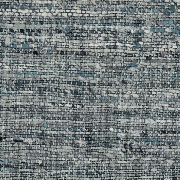 Close-up van de grove, geweven textuur van Arte Aspero 40542 in grijs- en blauwtinten.
