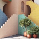 Decoratieve muur met kleurrijk Arte-behang Joy Join the Dots, omlijst door trappen en planten in terracottapotten.
