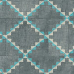 Grijsblauw Arte Janela behang uit de Gitane collectie met een geometrisch patroon in turquoise en wit.