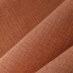 Textiel met een fijne linnenstructuur in de kleur ginger uit de Arte Textura Gioco collectie.