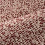 Detail van het Arte behang Kharga Atacama 74014 in de kleur Flaming Red met een grove, geweven textuur.