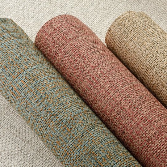 Drie rollen geweven Arte Nongo behang uit de Gitane collectie in natuurlijke tinten.