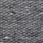 Close-up van het grijs geweven Perletta Finesse vloerkleed van Buningh Wonen.