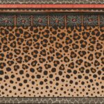 Behang met luipaardprint en decoratieve Zulu-geïnspireerde border in aardetinten van Cole and Son.