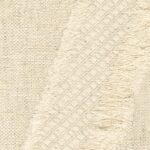 Detailopname van Elitis Baleares Duna stof in een crèmekleurige geweven en franjerijke textuur.