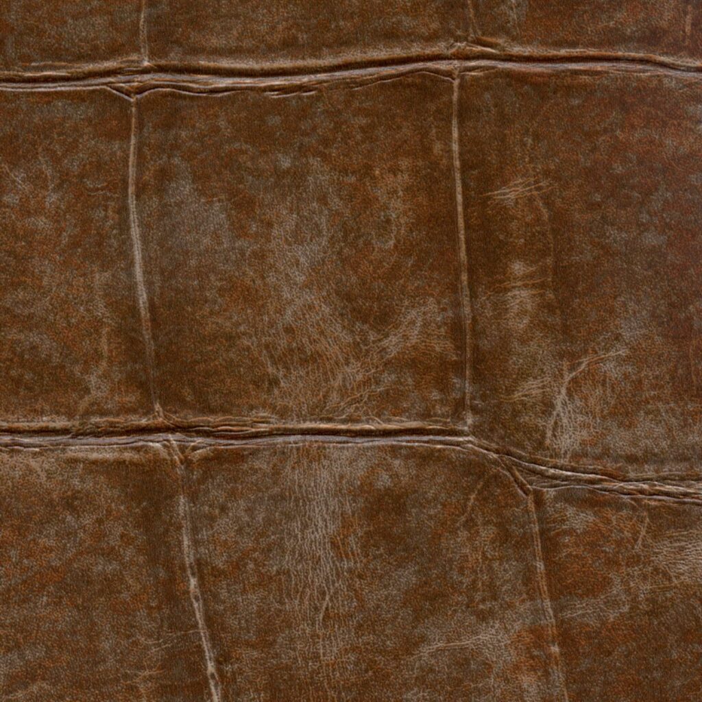 Close-up van bruin Elitis behang Big Croco VP 426 08 met een krokodillenleerstructuur.