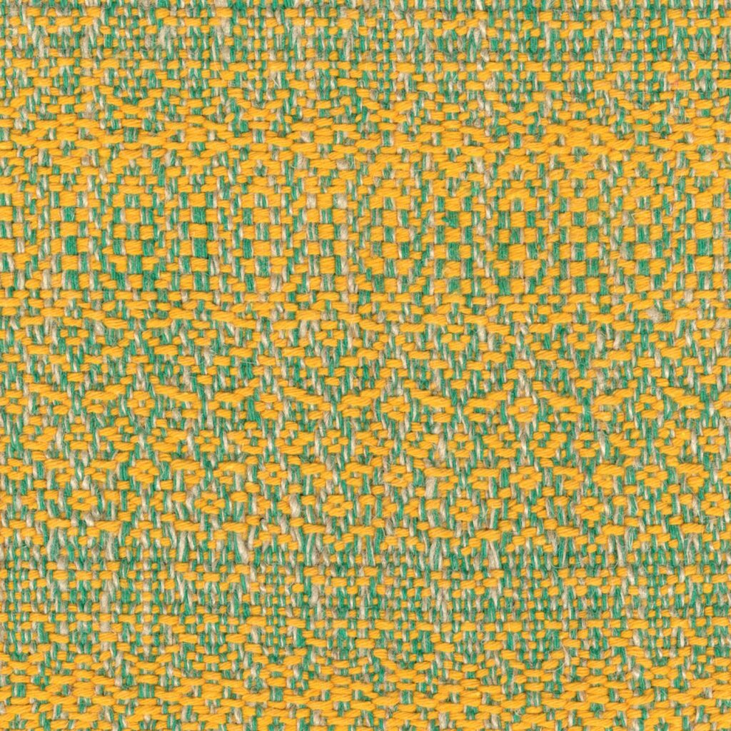 Geweven stofpatroon van Elitis Excentric Andy in geel en groen met een gedetailleerde textuur.