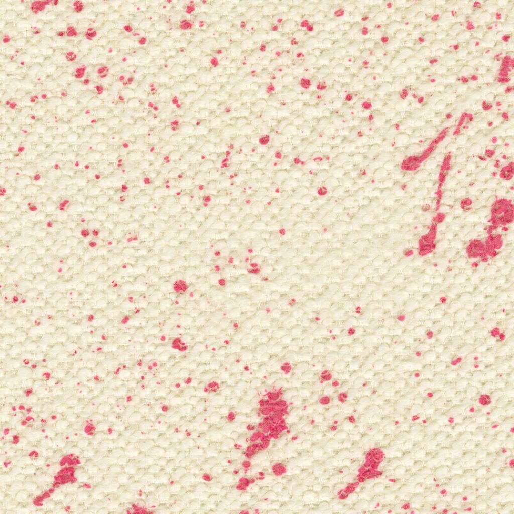 Close-up van de Elitis Excentric Jacky stof met een crèmekleurige textuur en roze verfspatten.