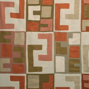 Decoratieve Elitis-stof met geometrisch patroon in aardetinten zoals rood, roze, beige en olijfgroen.