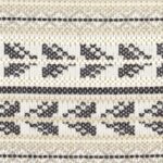Detailopname van Elitis-stof Acosta Santa Rosa OD 137-85 met een beige, witte en zwarte geweven patroon.