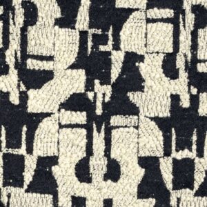 Detail van de Elitis-stof Alchimia Giorgio LR 344 01 met een zwart-wit abstract geometrisch patroon in reliëf.