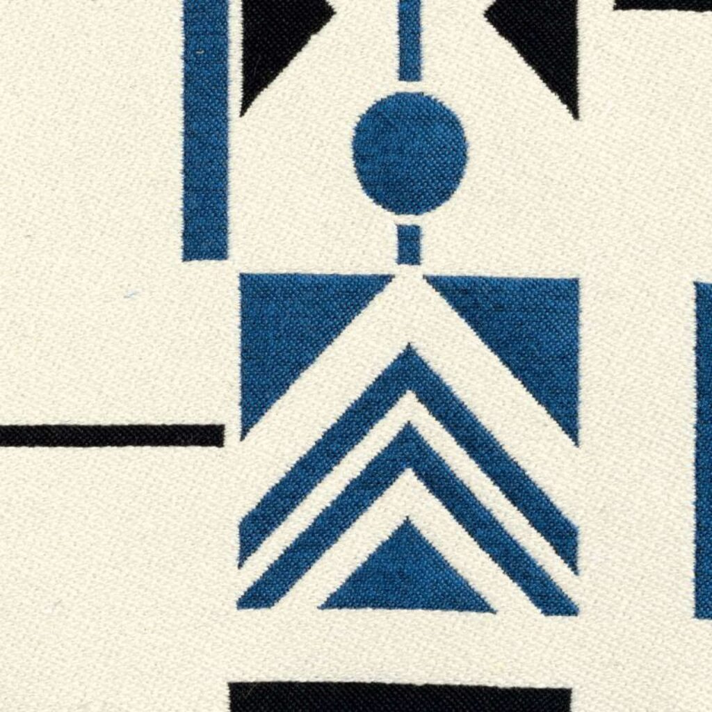 Detail van Elitis-stof Alchimia Mondo LR 342 45 met geometrisch patroon in blauw, zwart en wit.