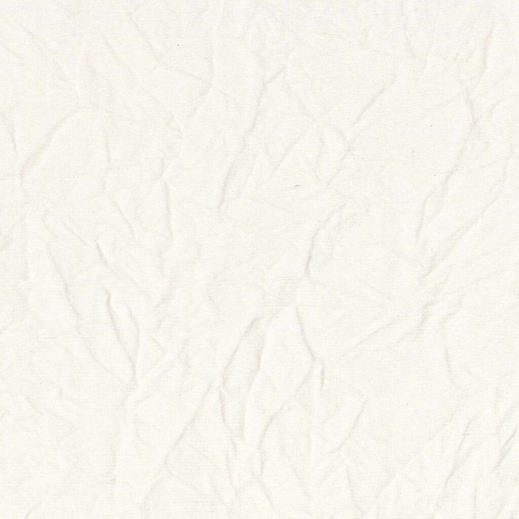 Licht gekreukelde, witte Elitis Ephemere Junichi LW 906 01 stof met een subtiele textuur.