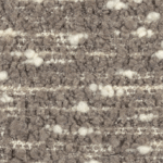 Close-up van de Elitis Horizon LI 875 05 meubelstof met een grofgeweven boucléstructuur in beige- en crèmetinten.