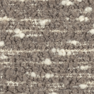 Close-up van de Elitis Horizon LI 875 05 meubelstof met een grofgeweven boucléstructuur in beige- en crèmetinten.