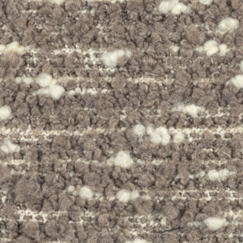 Close-up van de Elitis Horizon LI 875 05 meubelstof met een grofgeweven boucléstructuur in beige- en crèmetinten.