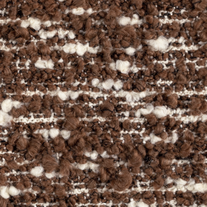 Close-up van de Elitis-stof Horizon LI 876 70 in bruin- en crèmetinten met grove textuur.
