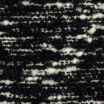 Detailopname van de Elitis-stof Horizon LI 876 80 met een grof geweven zwart-wit textuur.