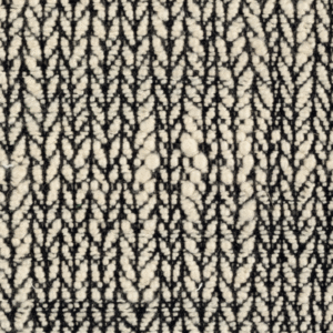 Detailopname van Elitis-stof Horizon LI 877 80 met een zwart-wit geweven zigzagpatroon.