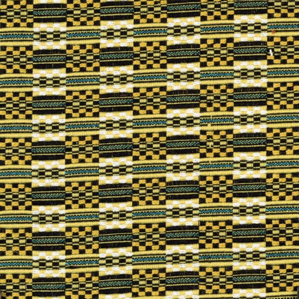 Detail van Elitis-stof Horizon LR 332 met een kleurrijk geometrisch patroon in geel, zwart, wit en groen.