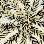 Detail van de Elitis outdoorstof Rio OD 118 01 met een abstract bladvormig patroon in geel, zwart en wit.