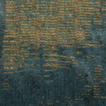 Detailopname van Eltis-stof Craft Chic Sera LR 336-47 met een geweven patroon in blauw- en goudtinten.