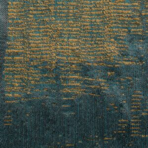 Detailopname van Eltis-stof Craft Chic Sera LR 336-47 met een geweven patroon in blauw- en goudtinten.