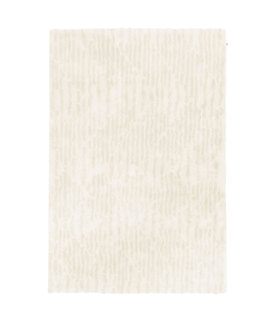 Crèmekleurig limited-edition vloerkleed 'Cosmic Vista Winter White' met subtiel patroon in bovenaanzicht.