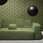 Groene bank voor een muur met het grafisch patroon van Moooi-behang Blooming Seadragon.