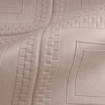 Detailopname van het reliëfpatroon op de stoffen bekleding van het designobject Pantheon_44031-I2OC-2.