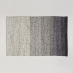 Vloerkleed Perletta Limone Fade Grey met een subtiele kleurverloop van lichtgrijs naar donkergrijs.