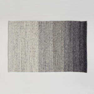 Vloerkleed Perletta Limone Fade Grey met een subtiele kleurverloop van lichtgrijs naar donkergrijs.