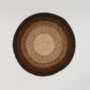 Ronde Perletta Roundabout Fade Yellow vloerkleed met een gele en bruine kleurverloop.