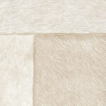 Detailopname van het patroon en de textuur van het lichte patchwork koeienhuid tapijt VP-618-03.