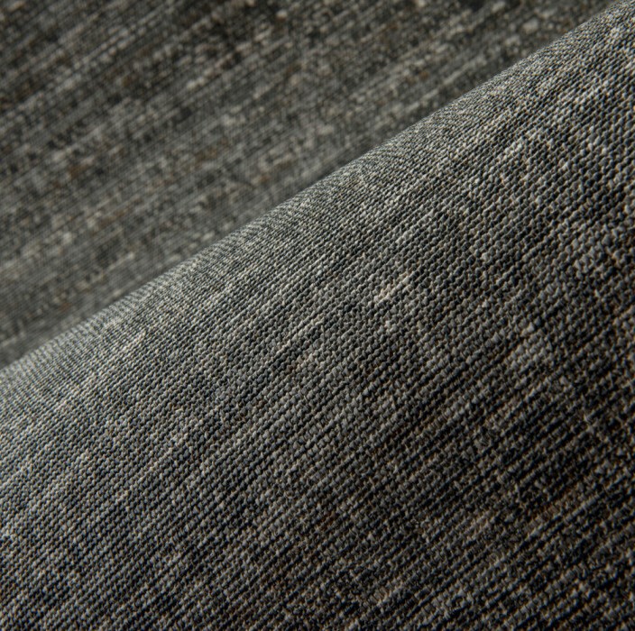 Detailopname van de geweven textuur van het Arte Aspero 40541 wandbekledingsmateriaal in grijstinten.