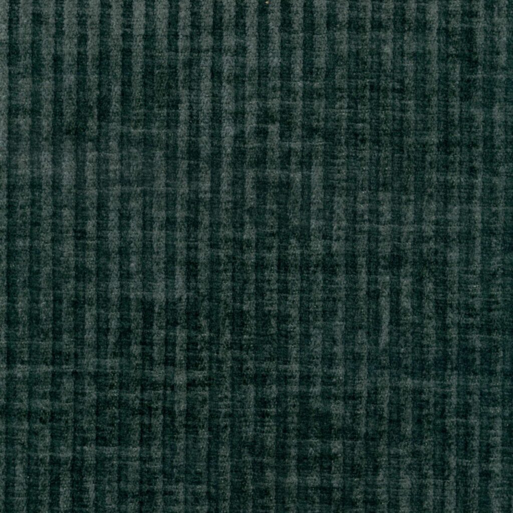 Detail van een bijzondere textielmuurbekleding met een blauw ribbeltje.