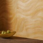 afbeelding van een muur met Elitis Calero VP 1028 behang in goud kleur